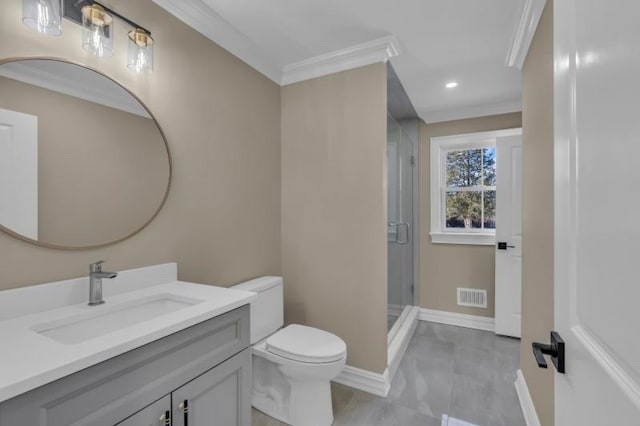 bathroom featuring ornamental molding, vanity, an enclosed shower, and toilet