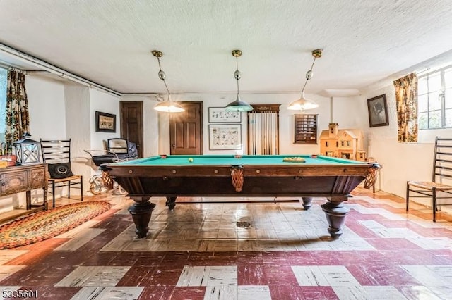 game room with billiards and a textured ceiling