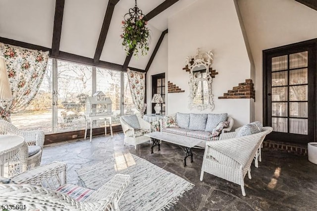 living room with beamed ceiling and high vaulted ceiling