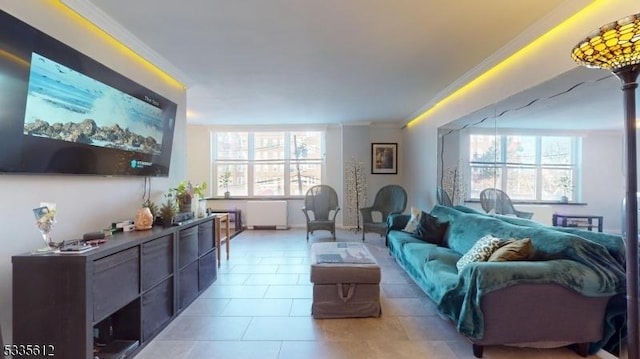 living room with crown molding and light tile patterned floors