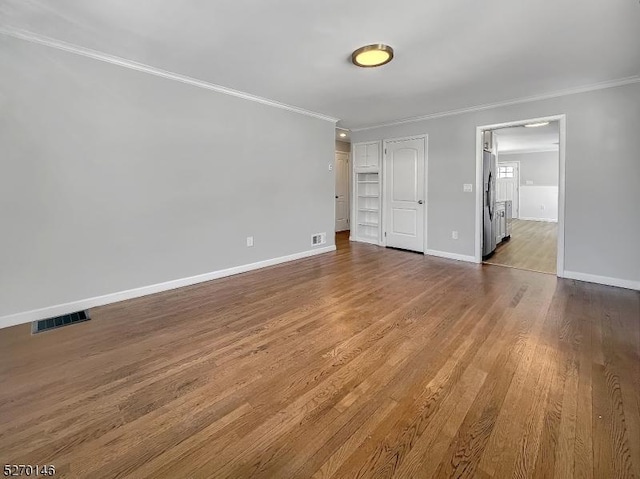 interior space with crown molding and wood-type flooring