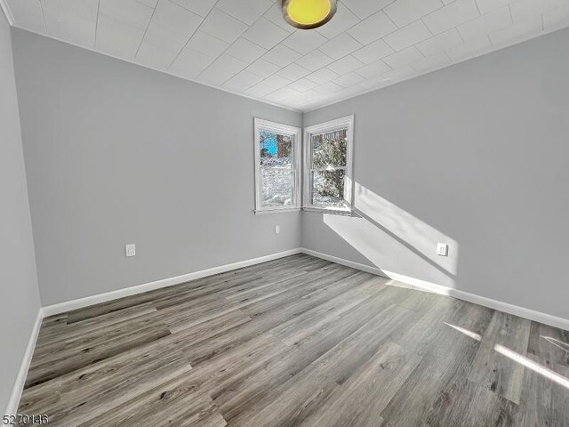 spare room featuring hardwood / wood-style floors