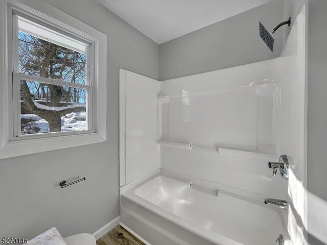 bathroom with washtub / shower combination