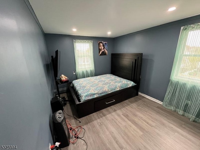 bedroom with light wood-type flooring