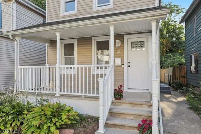 entrance to property featuring covered porch