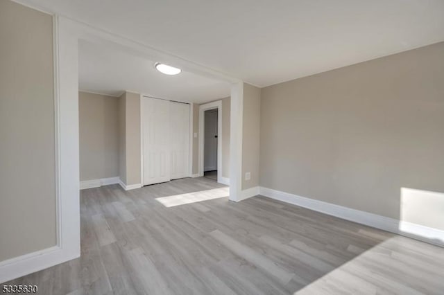 spare room with light hardwood / wood-style floors