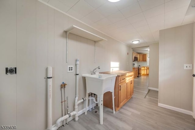 laundry area featuring light hardwood / wood-style flooring