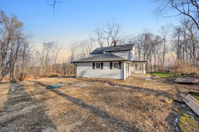 view of property exterior at dusk