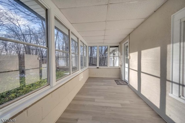 unfurnished sunroom with a paneled ceiling