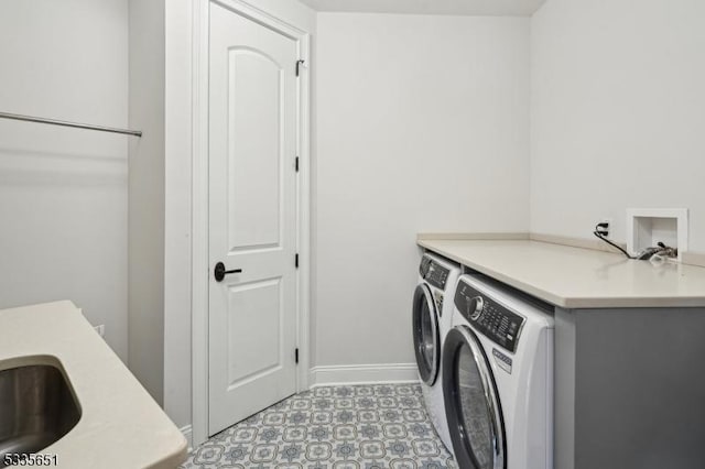 laundry room with sink and washer and clothes dryer