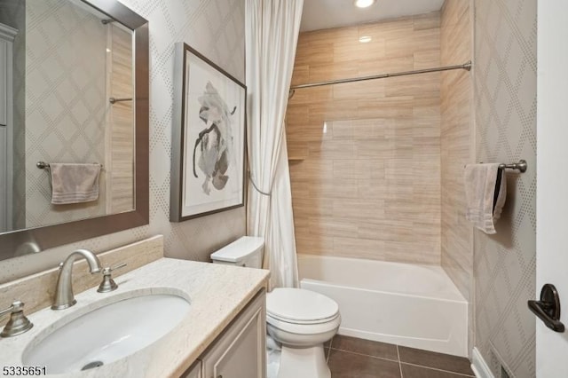 full bathroom with tile patterned flooring, shower / tub combo, vanity, and toilet