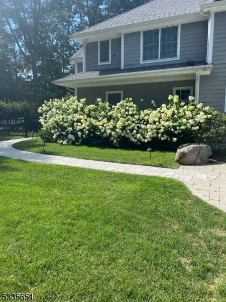 view of side of home featuring a yard