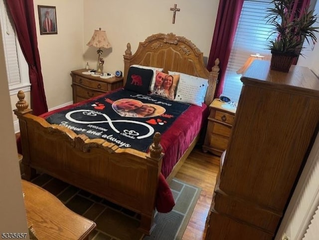 bedroom featuring wood-type flooring