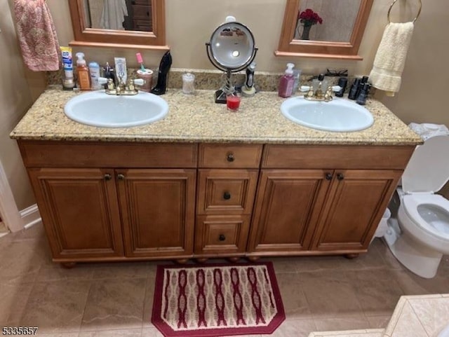 bathroom with vanity and toilet