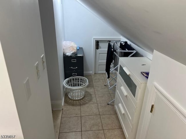 laundry room featuring light tile patterned floors