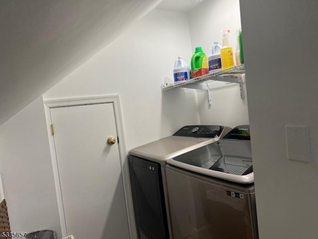 laundry room with washing machine and clothes dryer