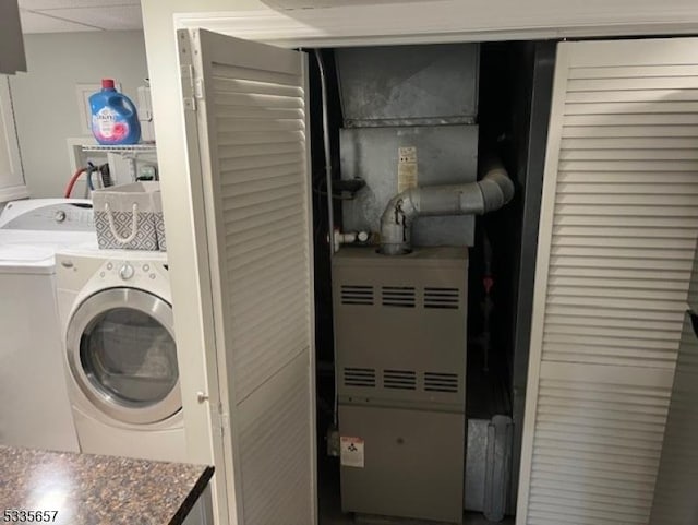 clothes washing area with washer and dryer