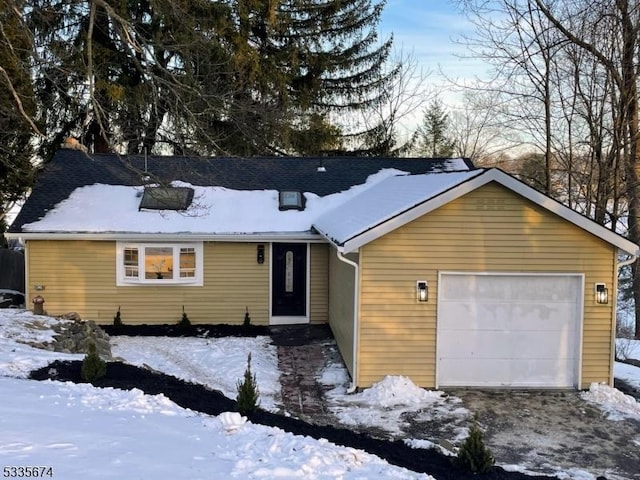 single story home featuring a garage