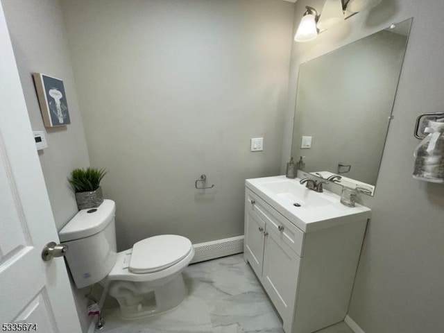 bathroom with marble finish floor, baseboards, vanity, and toilet