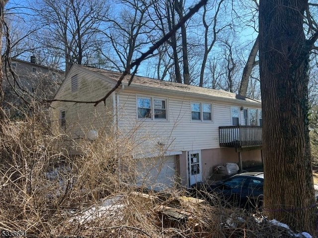 back of house with a garage