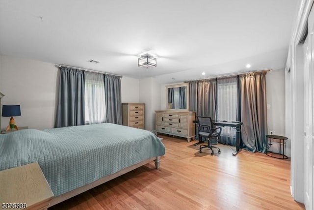 bedroom with hardwood / wood-style floors