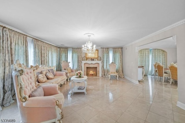 living room featuring ornamental molding and an inviting chandelier