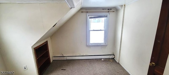 bonus room featuring carpet floors and a baseboard heating unit