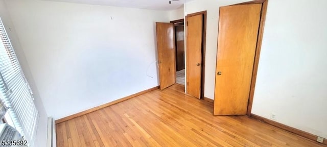 unfurnished bedroom featuring light wood-type flooring