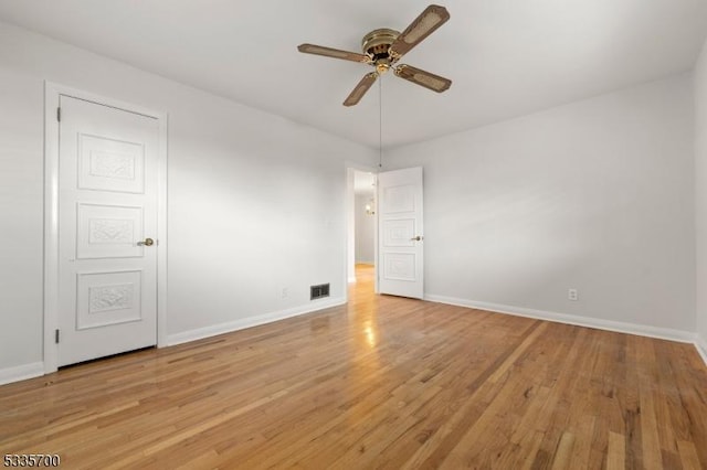 spare room featuring ceiling fan and light hardwood / wood-style flooring