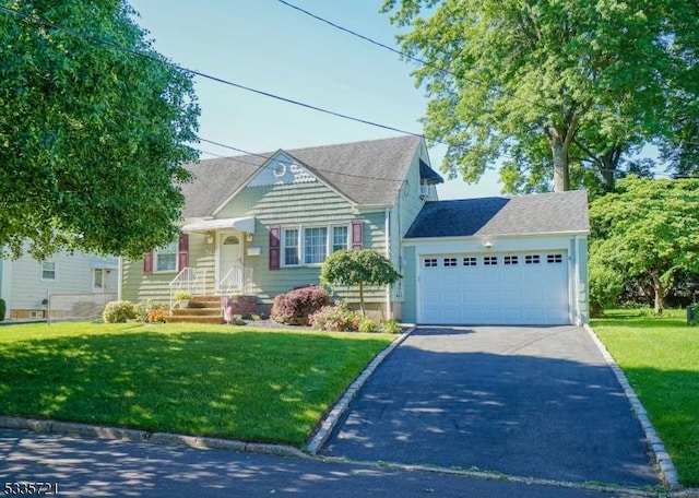 cape cod-style house featuring a front yard and a garage