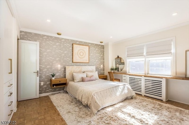 bedroom with parquet flooring and crown molding