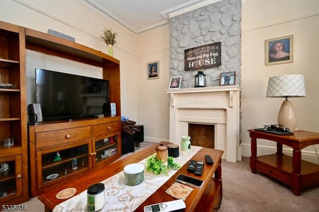 carpeted living room with crown molding and a large fireplace