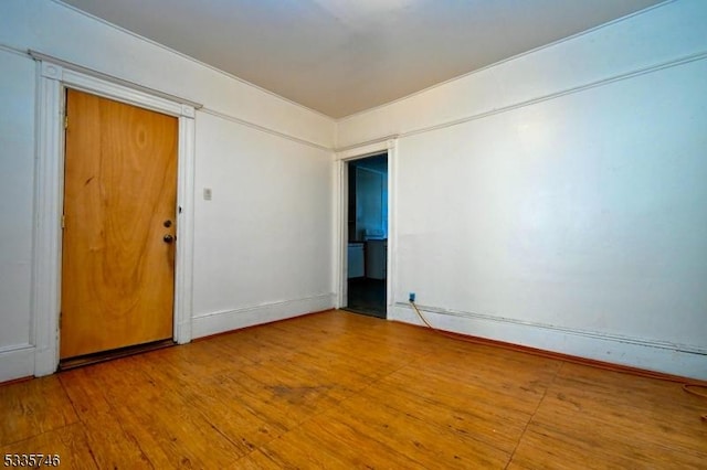 empty room with wood-type flooring