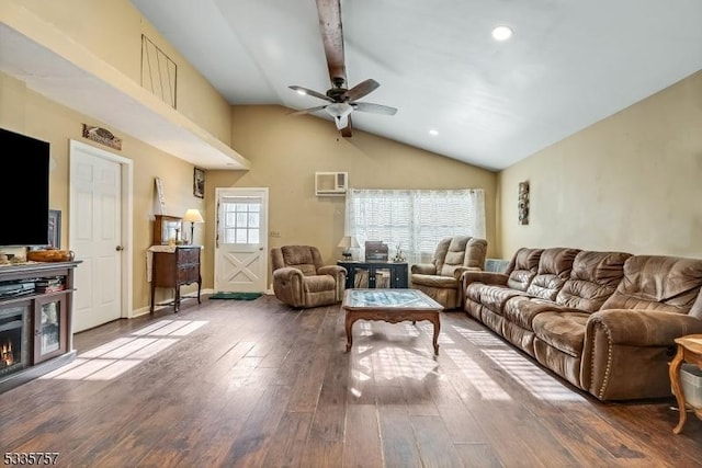 living room with wood-type flooring, ceiling fan, and vaulted ceiling