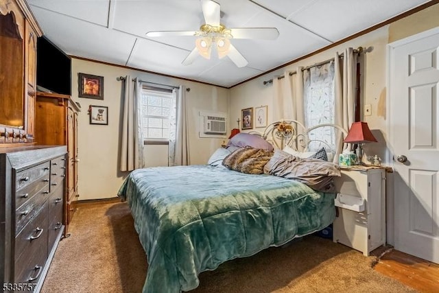 bedroom featuring crown molding, ceiling fan, and an AC wall unit