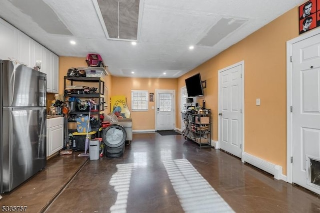 garage featuring stainless steel fridge