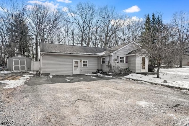 view of front of house featuring a storage shed