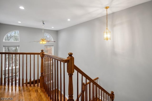 stairway featuring wood-type flooring