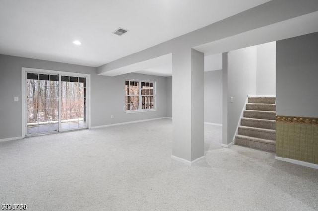 basement with light colored carpet and a healthy amount of sunlight