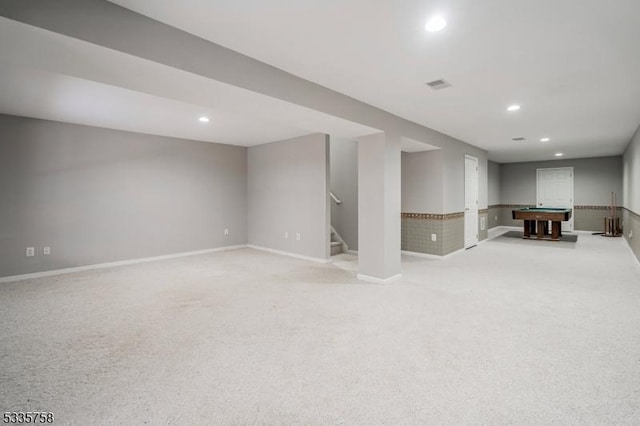 basement featuring light carpet and billiards