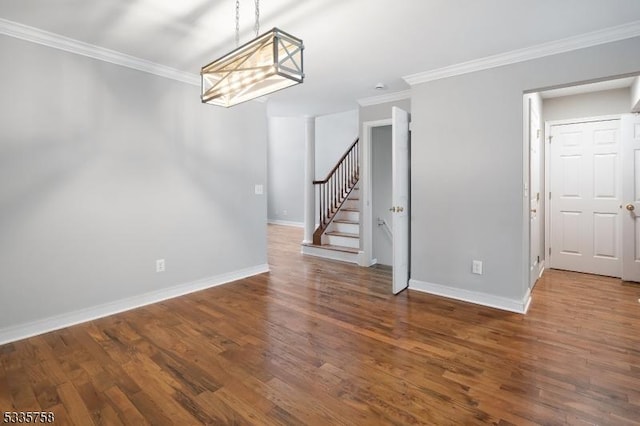 interior space with hardwood / wood-style flooring and crown molding