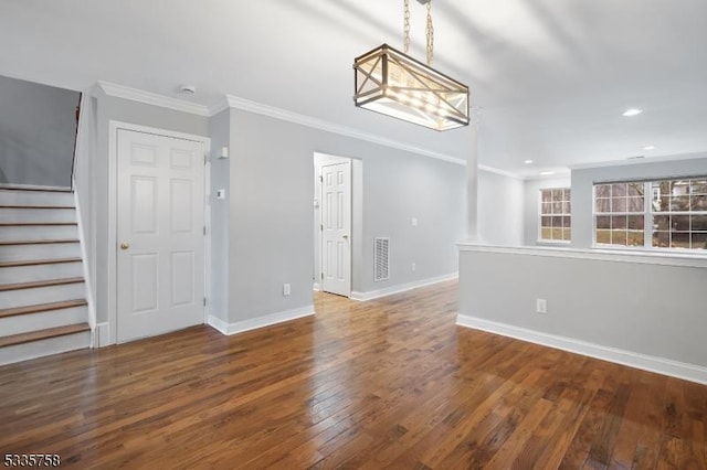 interior space with hardwood / wood-style flooring and ornamental molding