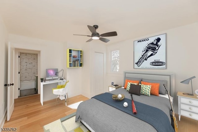 bedroom with a ceiling fan and wood finished floors