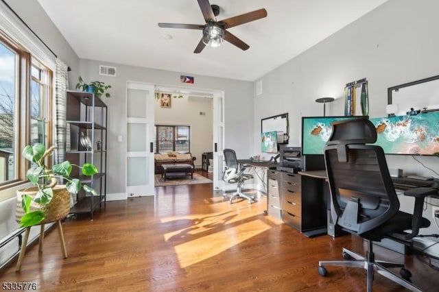 office area featuring dark hardwood / wood-style floors and ceiling fan