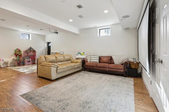 living room with light hardwood / wood-style flooring