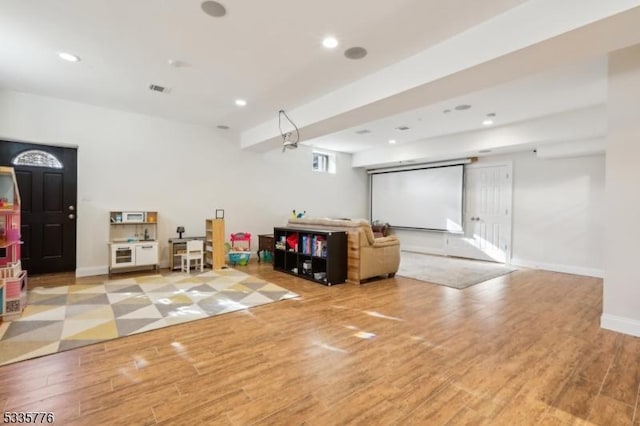 recreation room with light wood-type flooring