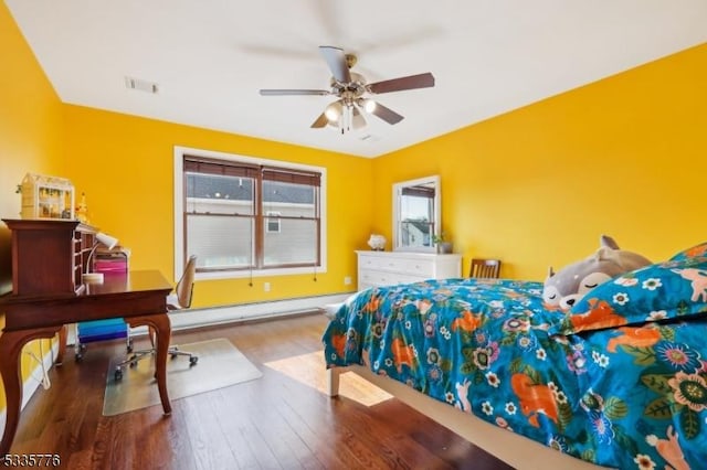 bedroom with ceiling fan, wood-type flooring, and a baseboard radiator