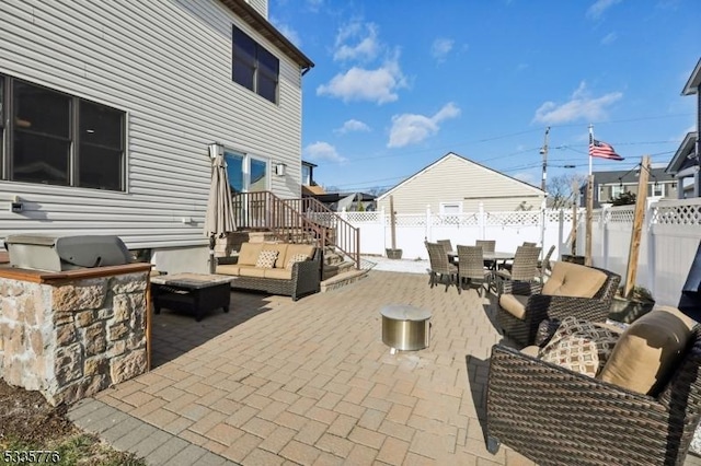 view of patio featuring outdoor lounge area and an outdoor kitchen