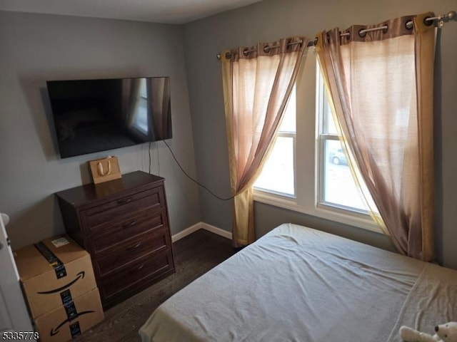 bedroom featuring dark hardwood / wood-style flooring