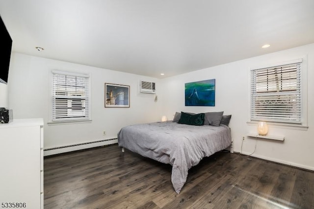 bedroom with a wall unit AC, baseboard heating, dark wood-type flooring, and recessed lighting